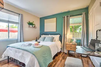 a bedroom with a bed and a window at 1 Mi to Dtwn Burbank Mod Gem with Private Yard in Burbank