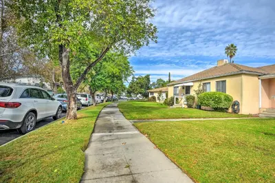 a sidewalk in a residential neighborhood with cars parked at 1 Mi to Dtwn Burbank Mod Gem with Private Yard in Burbank
