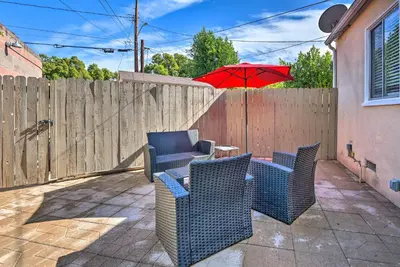a patio with chairs and a table with an umbrella at 1 Mi to Dtwn Burbank Mod Gem with Private Yard in Burbank