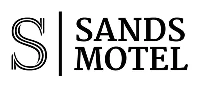a black and white sign with the words sants miced at Sands Motel by Ontario Airport & Toyota Arena in Ontario