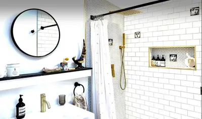 a bathroom with a mirror and a sink and a shower at Romantic cottage with amazing garden in Glendale