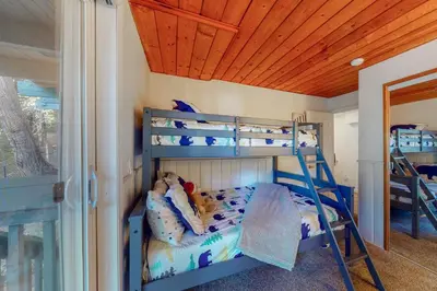 a bedroom with two bunk beds in a room at The Retreat on Wabash Lane in Lake Arrowhead