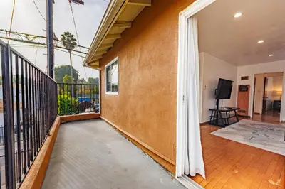 a balcony of a house with a tv at Spacious Two Bedroom in Santa Monica #E in Los Angeles