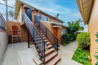 a house with a staircase in front of it at Spacious Two Bedroom in Santa Monica #E in Los Angeles