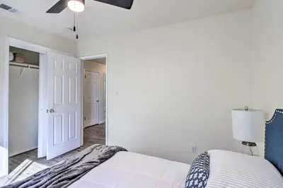a bedroom with a bed and a ceiling fan at Family-Friendly Getaway Community Amenities! in Bakersfield