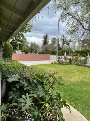 a porch with a garden with plants and a lawn at Vacation Rental w Pool &Garden 6 Guests near CSUN in North Hills