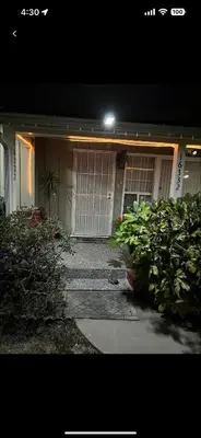 a house with two doors and a walkway in front at Vacation Rental w Pool &Garden 6 Guests near CSUN in North Hills