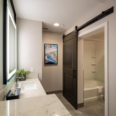 a bathroom with a shower and a sink and a toilet at Ayres Hotel Rialto Fontana in Rialto
