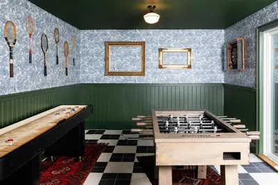 a play room with a wooden foosball table at NP Boutique Lodge in Big Bear Lake