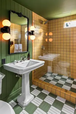 a bathroom with a sink and a mirror at NP Boutique Lodge in Big Bear Lake