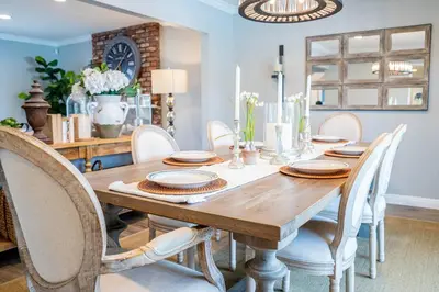 a dining room with a wooden table and chairs at Private Pool Oasis/Disney 15mins /Disney+ HBO/Gym in Placentia