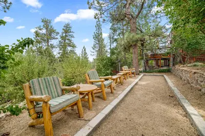 a row of chairs and tables in a garden at Narrow Escape - Close to Lake and Slopes in Big Bear Lake