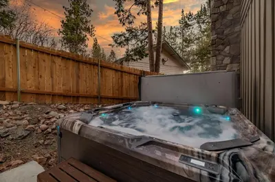 a jacuzzi tub with lights in a backyard at Lakeview Trout N About - Walk to Lake, Close to Village & Slopes in Big Bear Lake