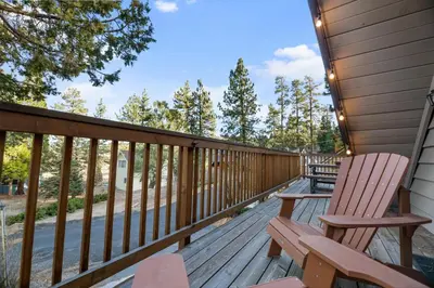 a deck with two rocking chairs on a house at Lakeview Trout N About - Walk to Lake, Close to Village & Slopes in Big Bear Lake