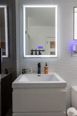 a bathroom with a white sink and a mirror at Fam Friendly 2BD 8min from airport, 4min from SoFi in Los Angeles
