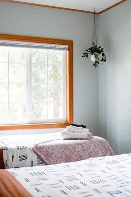 a bedroom with a bed and a window at Aery Pines in Wrightwood