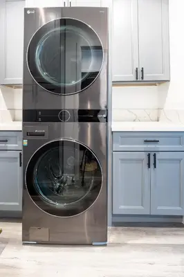 a stainless steel washer and dryer in a kitchen at Bungalow w Free Parking 4 min from SoFi, 8min from airport in Los Angeles
