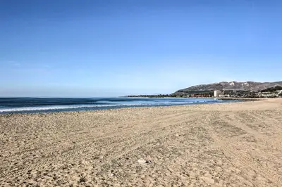 a sandy beach with the ocean in the background at Walk to Ventura Beach Comfy Home with Ocean Views in Ventura