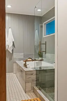 a bathroom with a tub and a sink at Modern Treetop Cabin by Lake Arrowhead Village in Lake Arrowhead