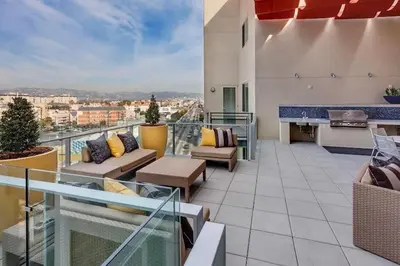 an apartment balcony with a view of a city at Luxury 2 Bedroom 2 Bathroom With Fitness Center and Pool in Los Angeles