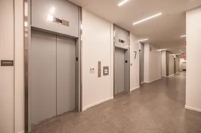 a hallway with white walls and doors in a building at @ Marbella Lane - Aesthetic 2BR w/Ocean views in Long Beach