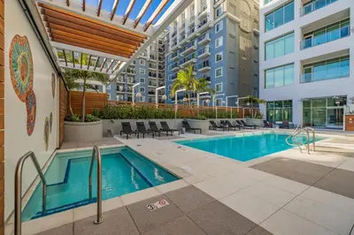 a swimming pool in a building with a building at @ Marbella Lane - Aesthetic 2BR w/Ocean views in Long Beach