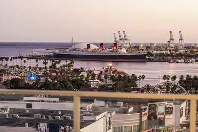 a cruise ship is docked in a harbor at @ Marbella Lane - Luxury Beachside 2BR in Long Beach