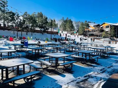 a group of picnic tables in the snow at Sled-Ski Snow Summit Lakeside Village - Spa - BBQ - Firepit - Loft - Games in Big Bear Lake