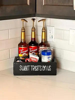a shelf with four bottles of alcohol on a kitchen counter at Adorable little cabin #28 in Kernville
