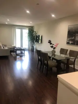 a living room with a table and chairs and a couch at Glendale Americana 2 Bedroom 2 Bathroom Condo in Glendale