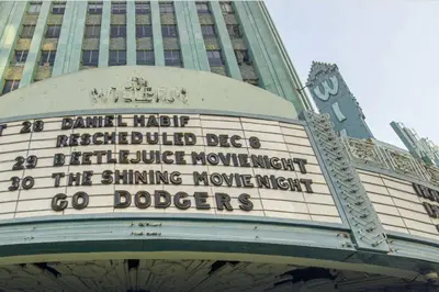 a building with a sign on the side of it at Magnolia Apt in Los Angeles