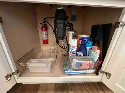 a light in a pantry with a shelf and a basket at La Casita de Whittier, Private Unit w/patio area, Disney, Biola, Knotts in Whittier