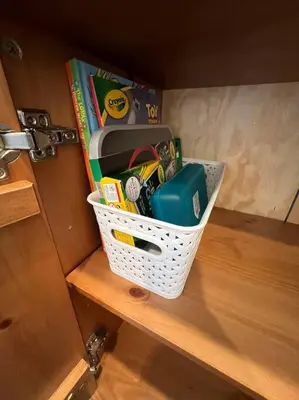 a basket sitting on top of a wooden shelf at La Casita de Whittier, Private Unit w/patio area, Disney, Biola, Knotts in Whittier