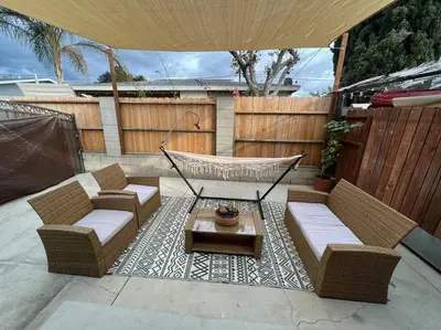 a patio with two couches and a hammock at La Casita de Whittier, Private Unit w/patio area, Disney, Biola, Knotts in Whittier