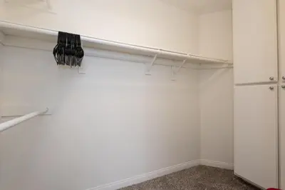 a room with white walls and a white closet at Skyline Terrace Executive Jr One Bedroom with Balcony and Pool in Los Angeles