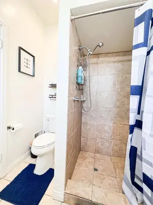 a bathroom with a shower and a toilet at Stylish Residence in Los Angeles - OL-WH in Los Angeles