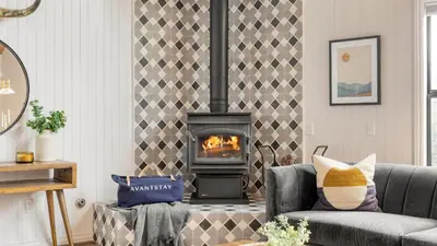 a living room with a fireplace and a couch at North Bay by AvantStay Chic Retreat w Peloton in Blue Jay