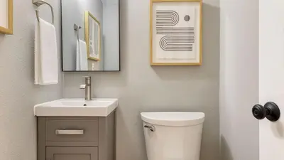 a small bathroom with a toilet and a sink at North Bay by AvantStay Chic Retreat w Peloton in Blue Jay