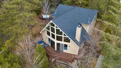 an overhead view of a house with a black roof at North Bay by AvantStay Chic Retreat w Peloton in Blue Jay