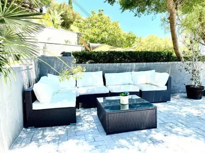 a patio with two white couches and a table at Malibu Secluded Escape Ocean View Zen House in Malibu