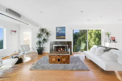 a living room with a couch and a fireplace at Malibu Secluded Escape Ocean View Zen House in Malibu