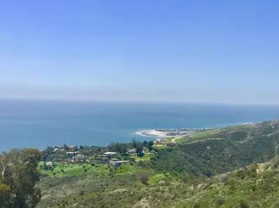 a town on a hill with the ocean in the background at Malibu Glass House: Architectural w 180deg Views in Malibu
