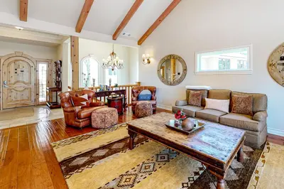 a living room with a couch and a table at Bayfront Beauty - Main in Lake Arrowhead