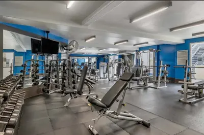 a gym with several treadmills and machines at The Nest a Spacious 1 Bedroom Apartment with a Pool View in Los Angeles