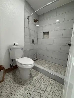 a bathroom with a toilet and a shower at Rosemead Motel in Rosemead