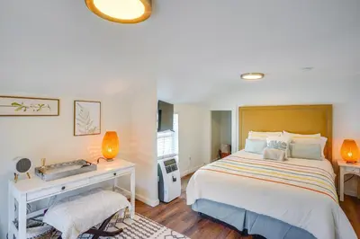 a bedroom with a large bed with a desk and a bed sidx sidx at Super Walkable! Historic Home in Dtwn Long Beach in Long Beach