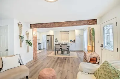 a living room with a couch and a table at Super Walkable! Historic Home in Dtwn Long Beach in Long Beach