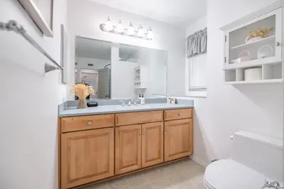 a bathroom with a sink and a mirror at #Marbella Lane - Charming 4BR Bungalo for Relaxing Retreat in Fullerton