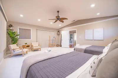 a bedroom with two beds and a ceiling fan at #Marbella Lane - Charming 4BR Bungalo for Relaxing Retreat in Fullerton