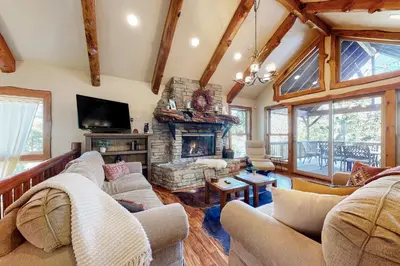 a living room with a couch and a fireplace at Arrowhead Haven in Lake Arrowhead